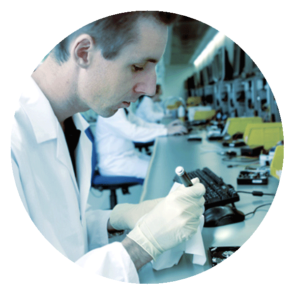 Data recovery cleanroom: engineer working on drive